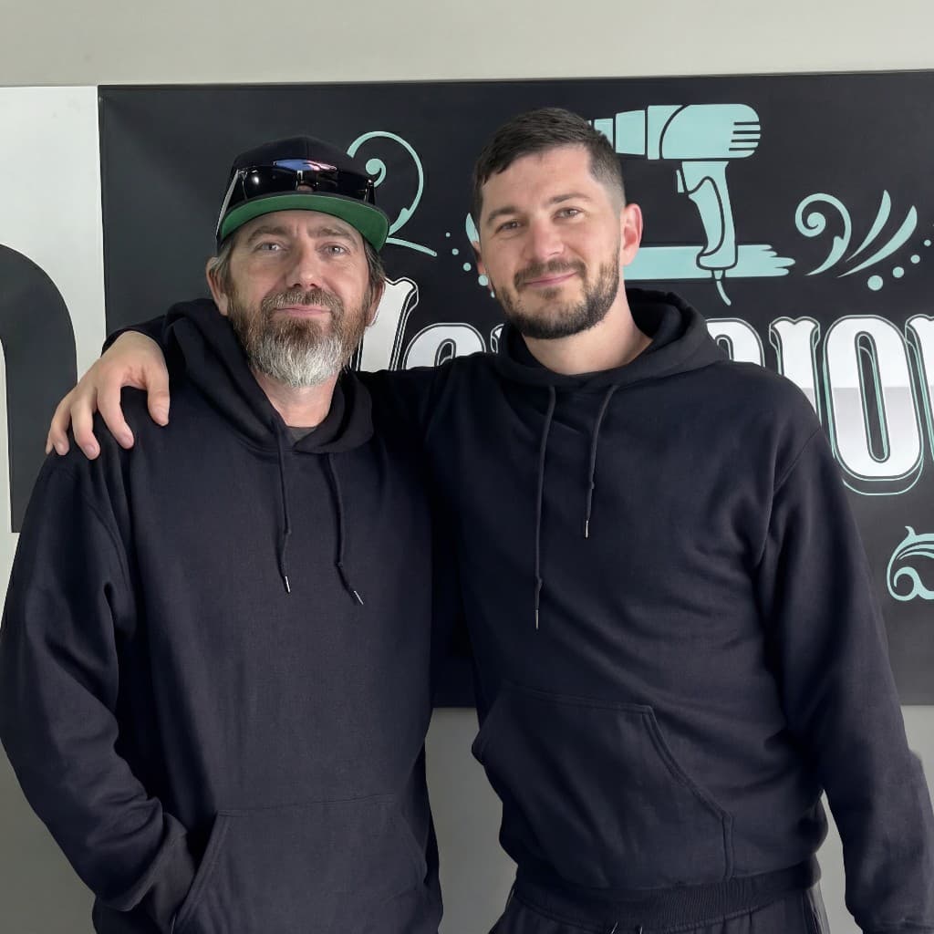 Elliot Baker with student Mike Morris at the Notorious Tint shop in Mesa, Arizona